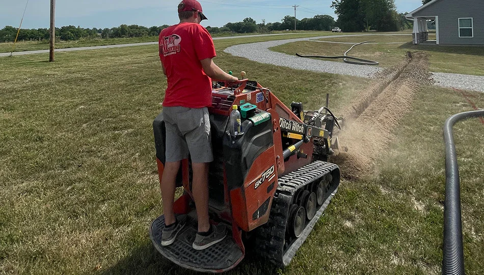 Professional creating a line for an irrigation system in Columbia, MO.